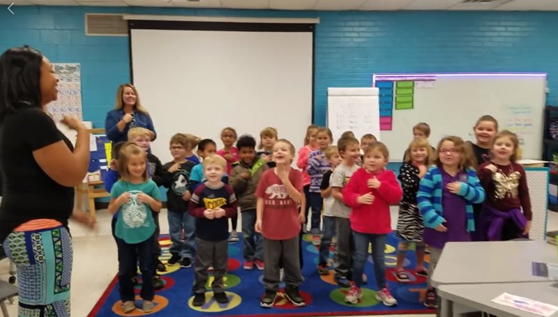 kids sing their favorite friend a happy birthday song in sign language